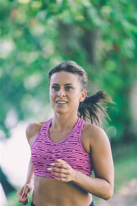 Runner Athlete Running At Park Woman Fitness Jogging Workout Wellness