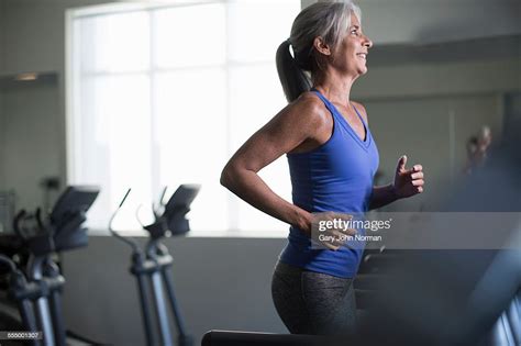 Mature Woman Running On Gym Treadmill Photo Getty Images