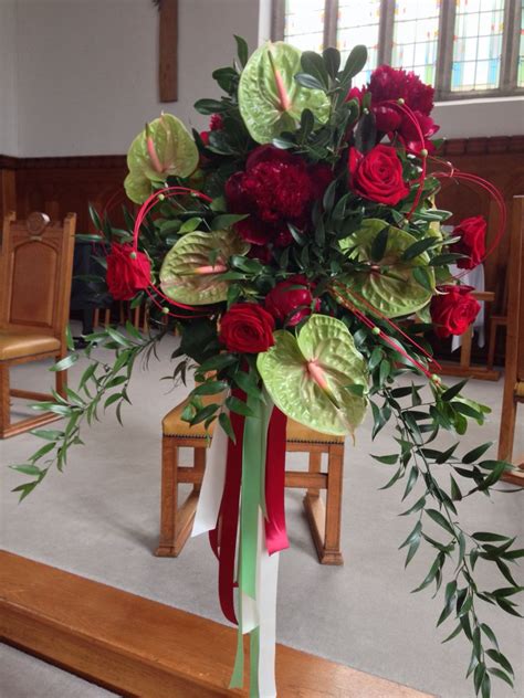 Durable plastic foliage and trees make ideal outdoor decorations, while more delicate foam or silk flowers are perfect for a small bunch of flowers to either walk down the aisle or to brighten a room in a vase. Red and green flower ball pedestal www ...