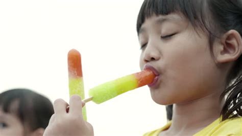 Girl Sucking Popsicle