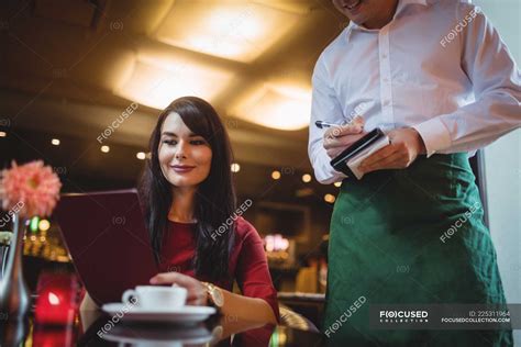 Waiter Taking Order From Woman In A Restaurant — Leisure Choosing
