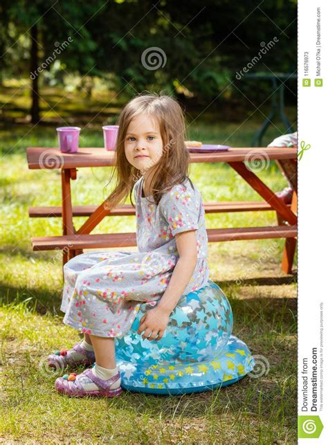 Girl Sitting At A Picnic Table Stock Image Image Of Cheerful Blue 116576973