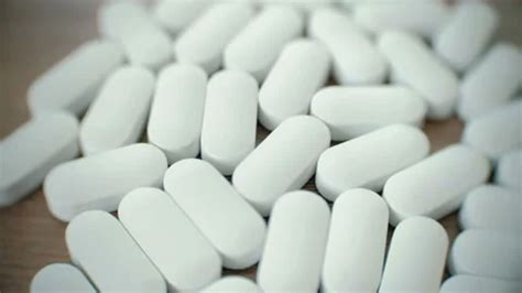 Closeup White Oval Pills On The Table Stock Video Pond5