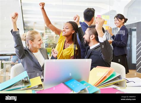 Cheering Start Up Team Celebrate Success At Work Stock Photo Alamy