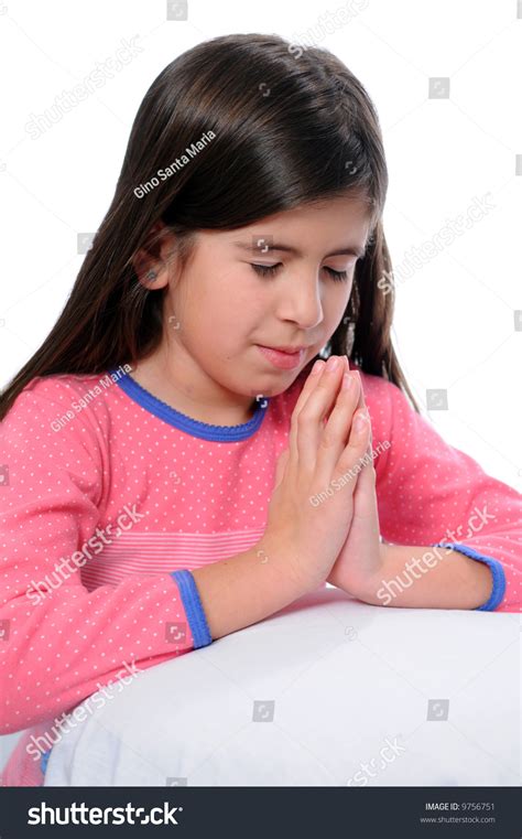 Young Girl Praying Before Bed Time Stock Photo 9756751