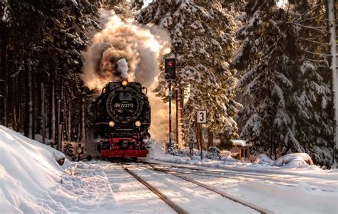 Train Chugging Along In Winter
