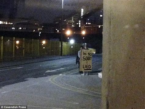 man spotted in manchester wearing sandwich board saying i m sorry i lied daily mail online
