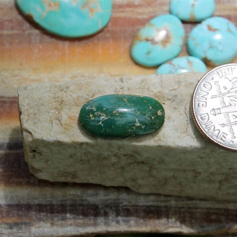 A Natural Dark Green Turquoise Cabochon Oval Stone
