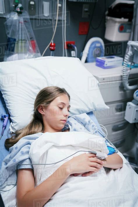 Caucasian Girl Laying In Hospital Bed Stock Photo Dissolve