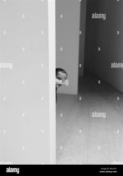 Girl Hiding Wall Hi Res Stock Photography And Images Alamy