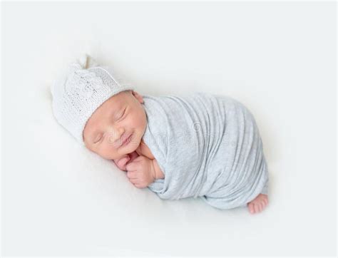 Sleeping Newborn Baby Swaddled In A Light Blue Wrap Stock Photo Image