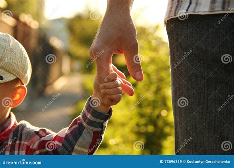 Parent Holds The Hand Of A Small Child Stock Image Image Of Baby