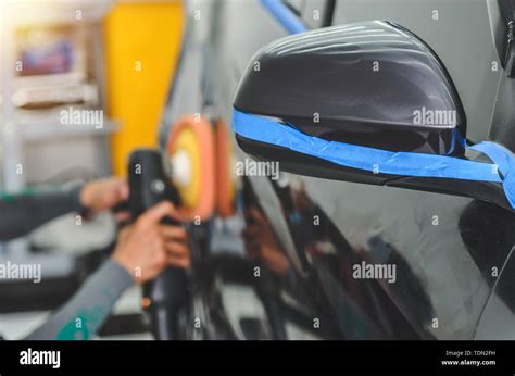 Mechanic Hand Holding The Car Polish Stock Photo Alamy