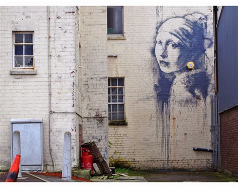Banksy Paints The Girl With Pierced Eardrum At The Dockside Studios