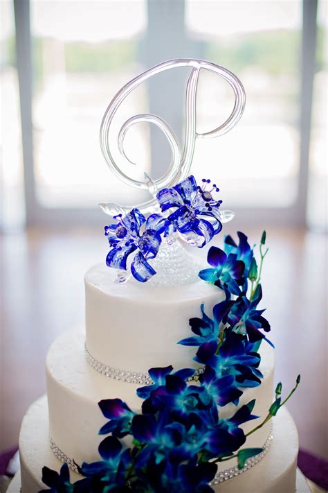 blown glass wedding cake topper buttercream frosting with blue dendrobium orchids blue orchid