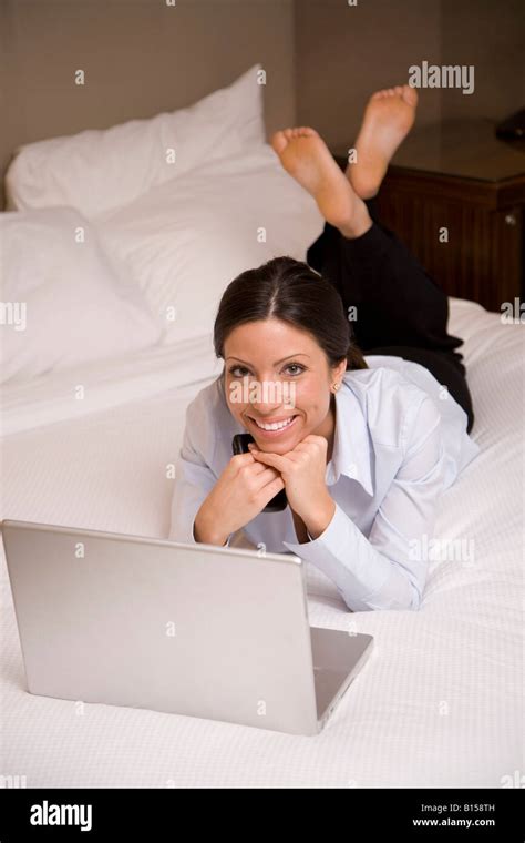 Portrait Of Young Businesswoman In Hotel Bed With Laptop Mr 5 31 08