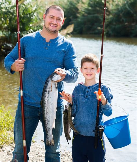 Laughing Father And Son Fishing With Rods Stock Photo Image Of Bait