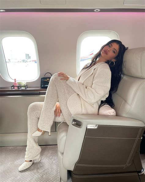 Kylie Jenner Nearly Busts Out Of Her Top As She Poses On Her 72m