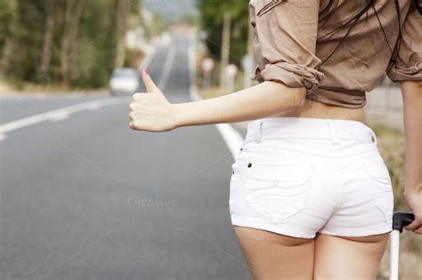 Girl Hitchhiking On The Road Hitchhiking Girl Cut Off Shorts