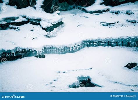 A Beautiful Ice Formations Along The Frozen River In Winter Stock Photo