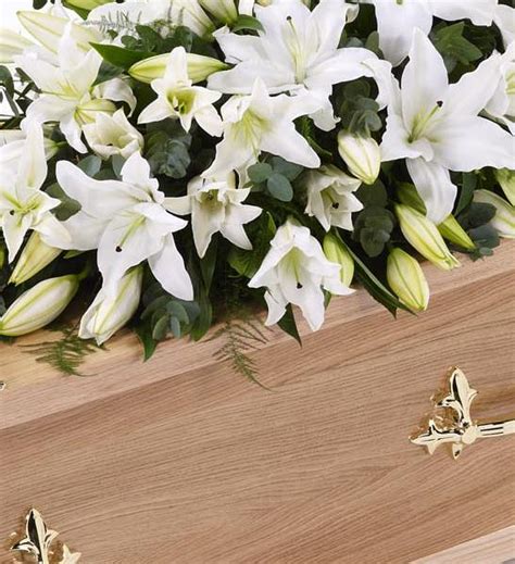 Gourmet gift baskets, pears & fruits, chocolates & sweets Lily Casket Spray - White 4ft - Funeral Flowers Birmingham