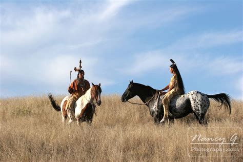Two Native American Indian Men On Horseback Scouting For Enemies Or