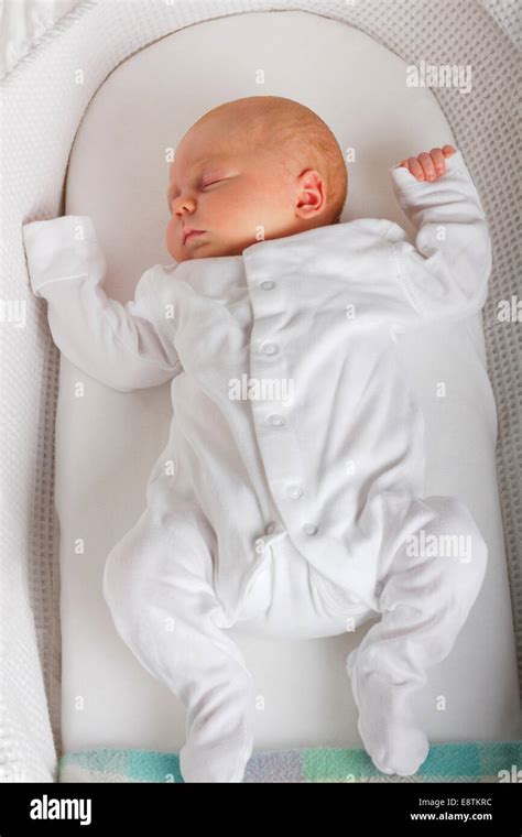 Newborn Baby Girl Sleeping In Crib