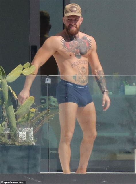 shirtless conor mcgregor displays his muscular tattooed physique in miami daily mail online
