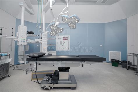 Empty Operation Room With Surgery Bed And Surgery Light Stock Photo