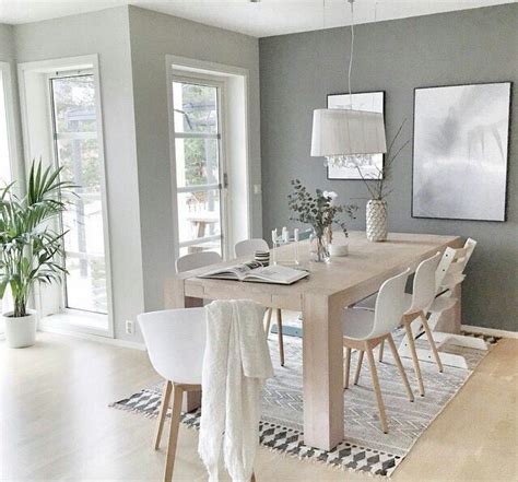 Browse our selection of contemporary, traditional, transitional and casual dining room tables and order with confidence online. dining room with light gray walls, light wood table and floors, white chairs and decor, and lots ...