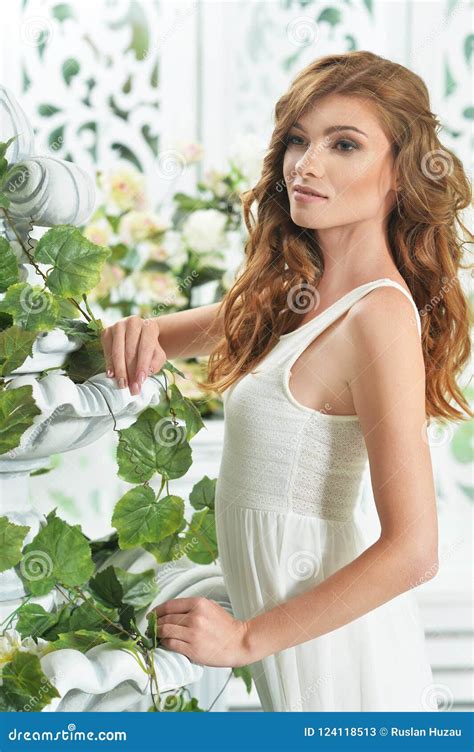 Portrait Of A Young Woman Posing In Room Decorated Stock Image Image