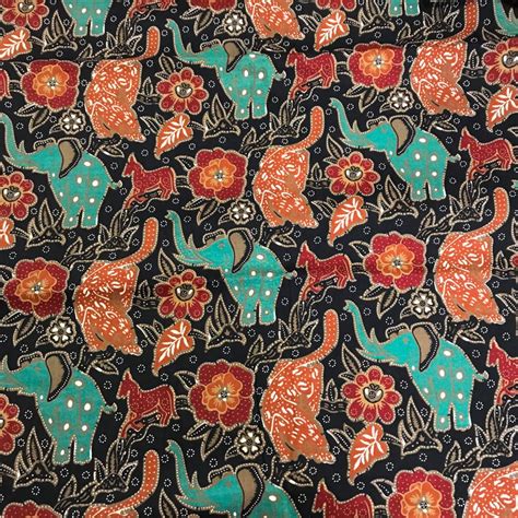 An Elephant And Flowers Pattern On A Black Background With Red Orange