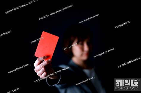Female Employee Issuing A Red Card Stock Photo Picture And Low Budget