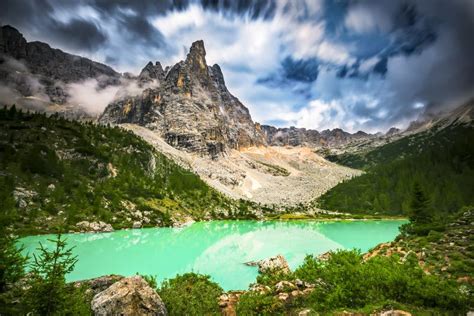 Famous Turquoise Lake Sorapis With High Mountains At Sunset Dolomites