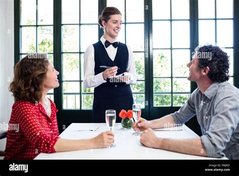Young Waitress Taking Order Stock Photos And Young Waitress Taking Order