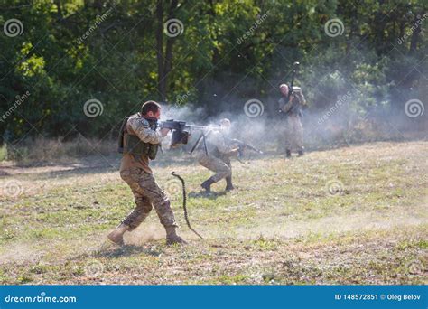 Special Forces Soldier Firing A Machine Gun From A Standing Position