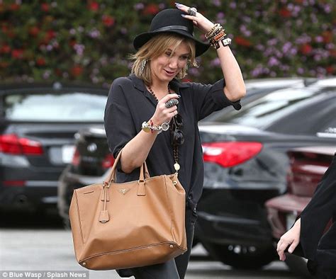 Delta Goodrem Swaps Her Bohemian Look For A Rock Chick Makeover And Leather Pants Daily Mail