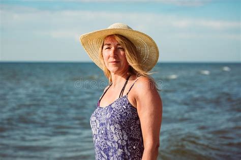 Beautiful Portrait Of Middle Aged Woman On The Beach Stock Image