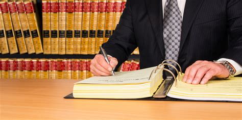 Lawyer Signing Legal Documents Policyfind