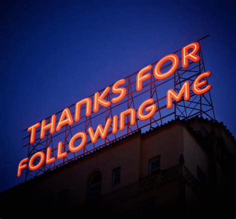 A Large Neon Sign That Says Thanks For Following Me On Top Of A Tall