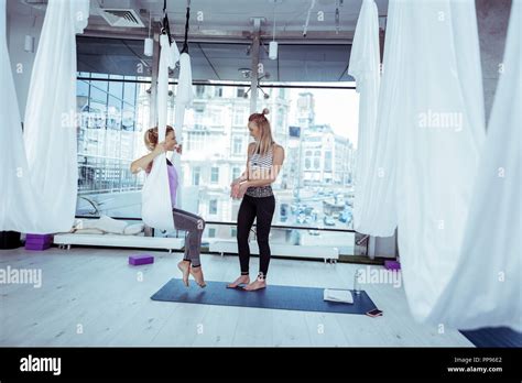 Pleasant Female Trainer Instructing Woman Before Yoga Stock Photo Alamy