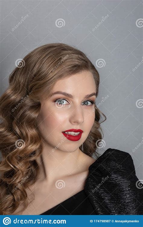 Emotional Portrait Of A Girl With Blond Wavy Hair In Vintage Style