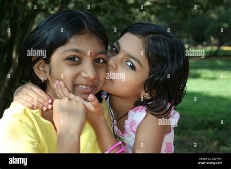 Bengaluru India Jan 05 2007 Younger Sister Affectionately Kissing Her Elder Sister Stock