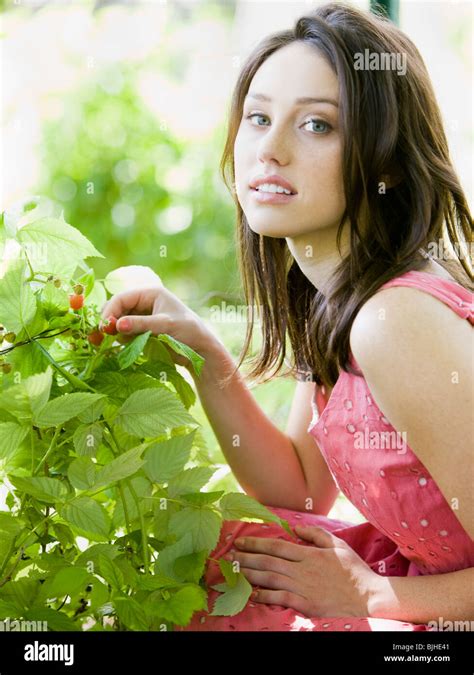 Woman In The Garden In A Summer Dress Stock Photo Alamy
