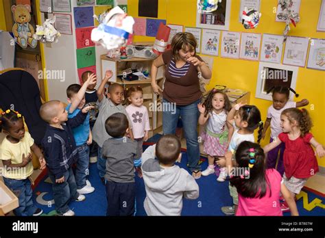 Preschool Children Dancing In The Classroom Stock Photo Alamy
