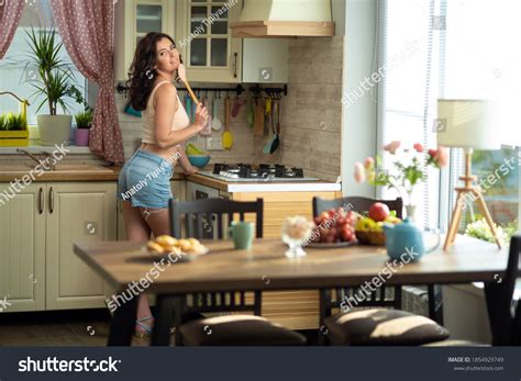 Beautiful Brunette Woman Housewife Iat Home Stock Photo