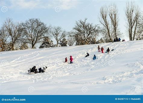 Children Playing With Snow After Snowfall On Winter Day In Tineretului