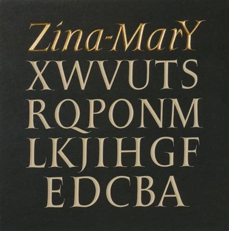 Photograph Of A Capital Alphabet With The Owners Name In Italics