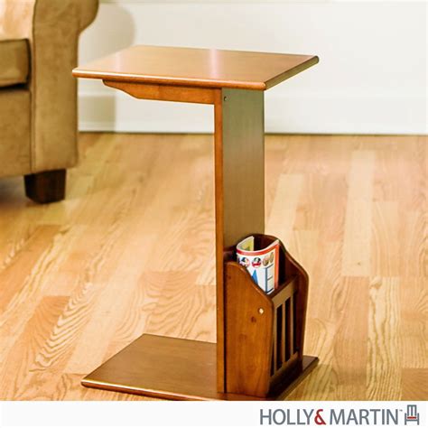 Sofa slide tables offer the convenience of a having a surface while lounging without the bulkiness of a coffee table standing in your way. Quirky Name for a Novel Concept: The Slide Under Couch Table