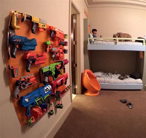 We recently posted a picture of a wall built for nerf guns on our instagram and facebook pages now you have yourself a really cool customize able organized tactical nerf wall for your kids room. Pin on Mini Costigans